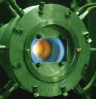 Combustion into vortex chamber